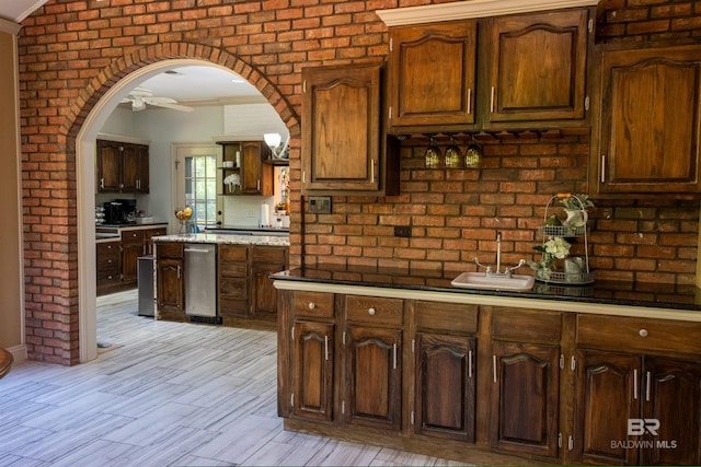 9150 County Road 91, Lillian, AL 36549 - kitchen with arched walkways, ornamental molding, a sink, ceiling fan, and open shelves