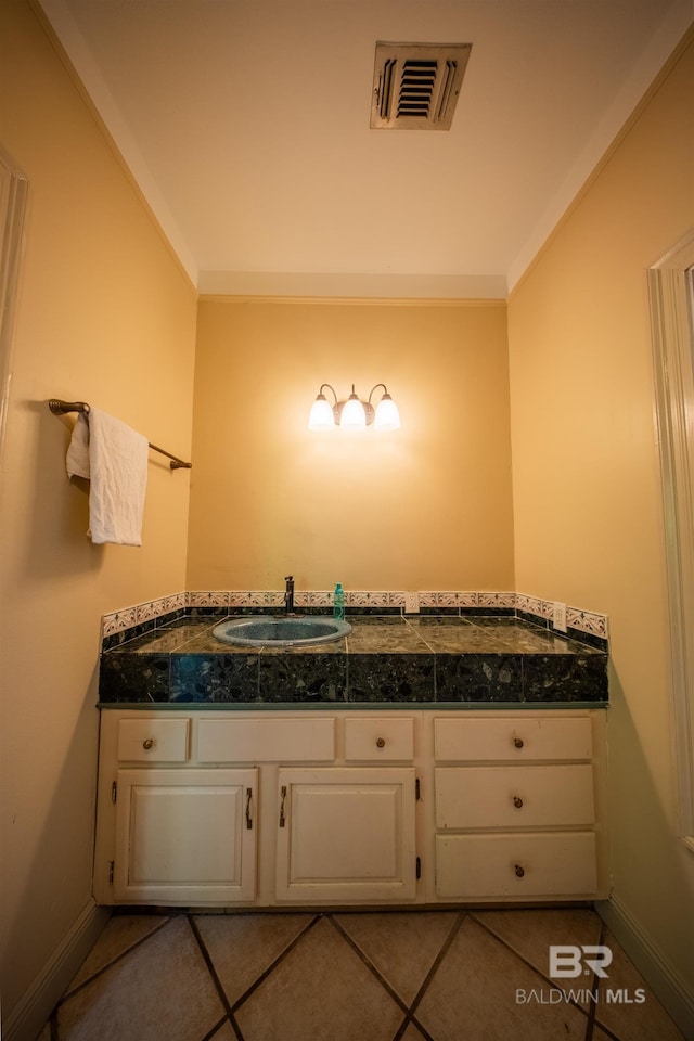 9150 County Road 91, Lillian, AL 36549 - bathroom with a sink, baseboards, and tile patterned floors