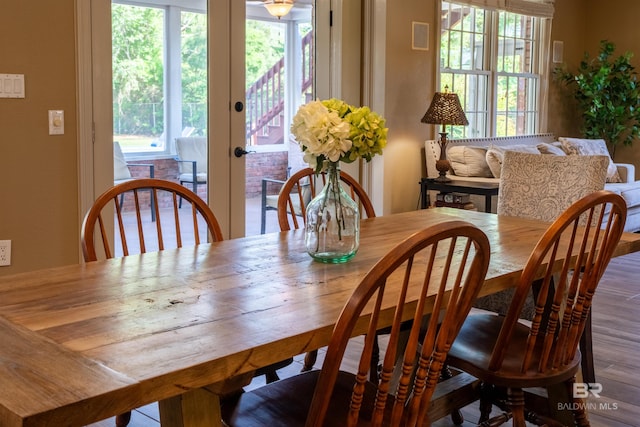 9150 County Road 91, Lillian, AL 36549 - dining space featuring healthy amount of natural light, french doors, and wood finished floors