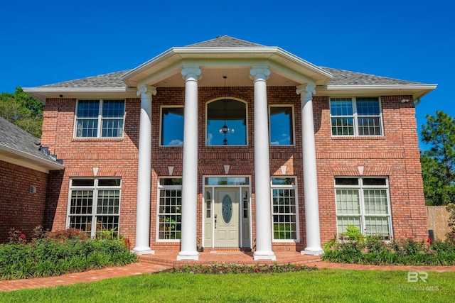 9150 County Road 91, Lillian, AL 36549 - neoclassical home with brick siding and a shingled roof