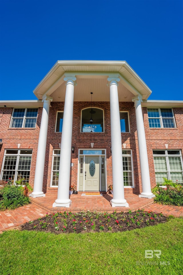 9150 County Road 91, Lillian, AL 36549 - view of front facade featuring covered porch and brick siding