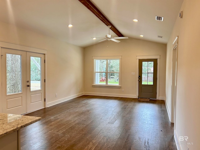 foyer entrance with ceiling fan, dark hardwood / wood-style floors, lofted ceiling with beams, and french doors