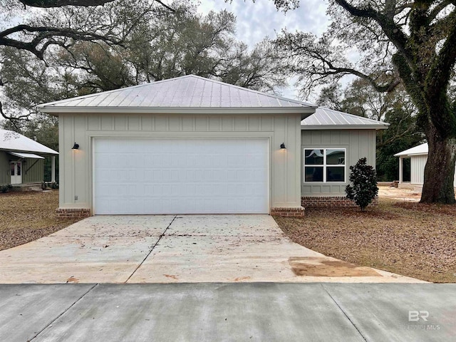 single story home with an outbuilding and a garage