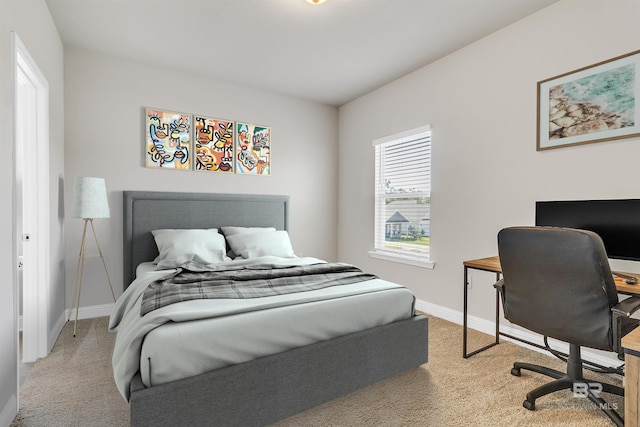 bedroom featuring light colored carpet