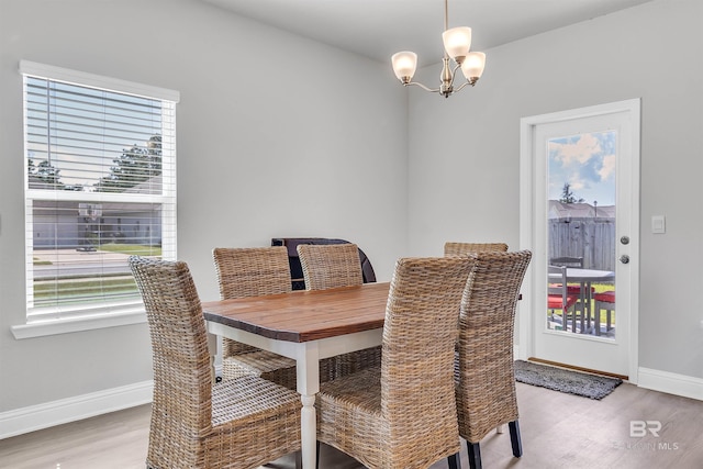 dining area featuring a chandelier and light hardwood / wood-style floors