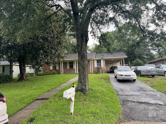 4303 Panorama Blvd, Mobile, AL 36609 - ranch-style home featuring a front lawn, driveway, brick siding, and an attached carport