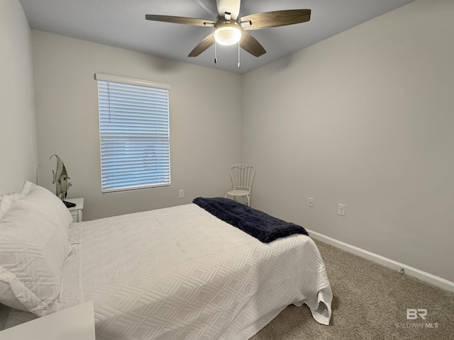 bedroom featuring baseboards, carpet flooring, and a ceiling fan