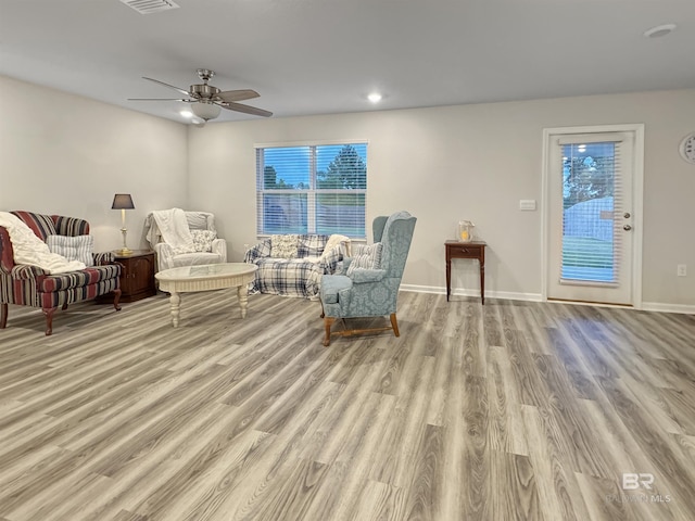 sitting room featuring a ceiling fan, visible vents, baseboards, light wood-style floors, and recessed lighting