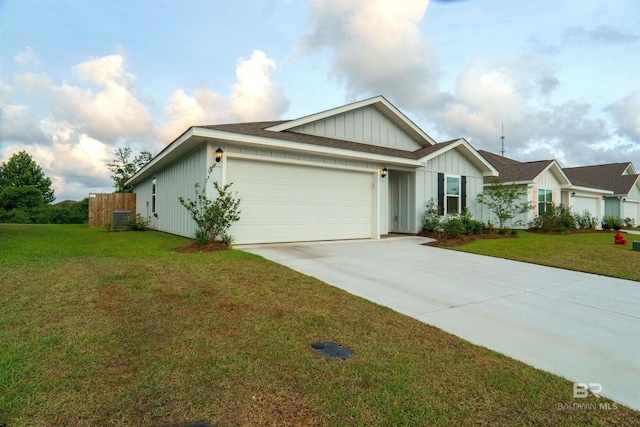 ranch-style house featuring board and batten siding, an attached garage, concrete driveway, and a front lawn