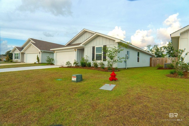 single story home with fence, an attached garage, a front lawn, board and batten siding, and concrete driveway