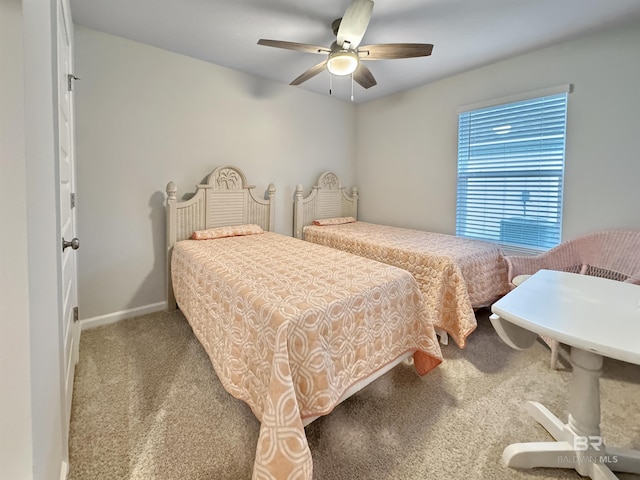 bedroom with carpet flooring, ceiling fan, and baseboards