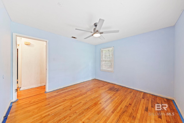 unfurnished room featuring ceiling fan and light wood-type flooring