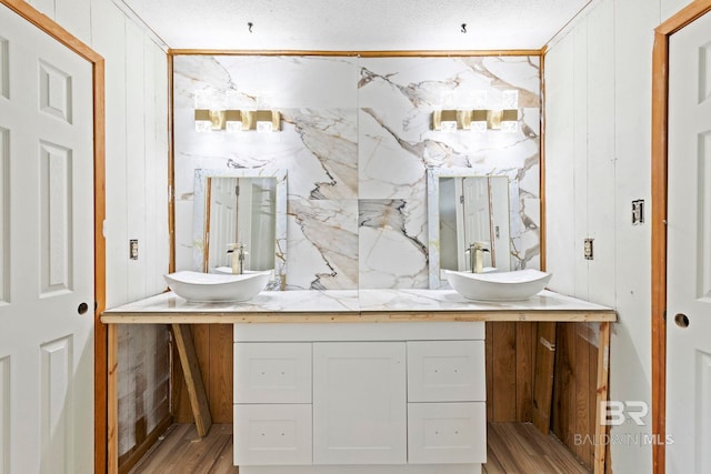 bathroom featuring hardwood / wood-style flooring and vanity