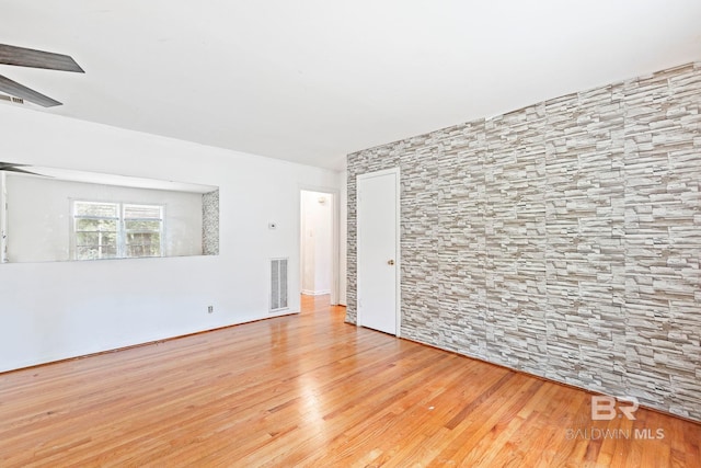 spare room featuring light hardwood / wood-style flooring