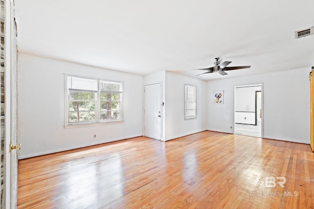 unfurnished living room featuring ceiling fan and light hardwood / wood-style flooring