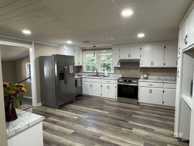 7121 N Century Blvd, Century, FL 32535 - kitchen featuring stainless steel appliances, a sink, under cabinet range hood, white cabinetry, and recessed lighting
