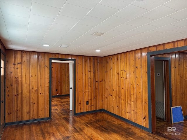 7121 N Century Blvd, Century, FL 32535 - empty room with wood finished floors, wood walls, and recessed lighting