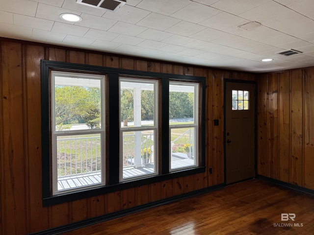 7121 N Century Blvd, Century, FL 32535 - foyer entrance with wood walls and dark wood-type flooring