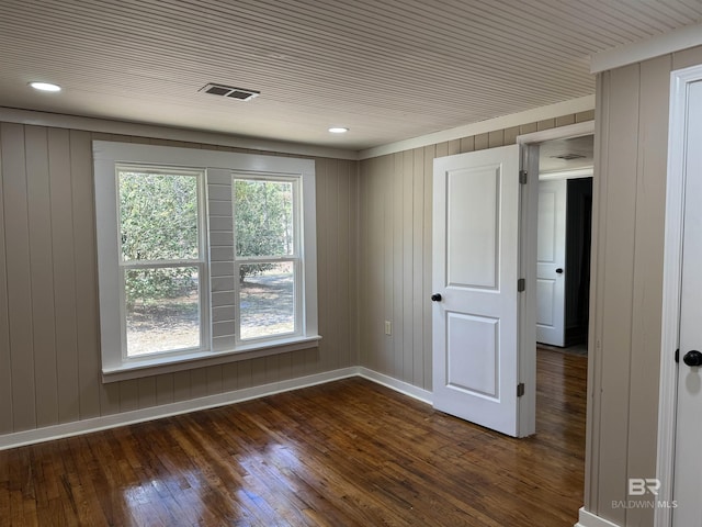 7121 N Century Blvd, Century, FL 32535 - empty room with dark wood-type flooring, baseboards, and wood walls