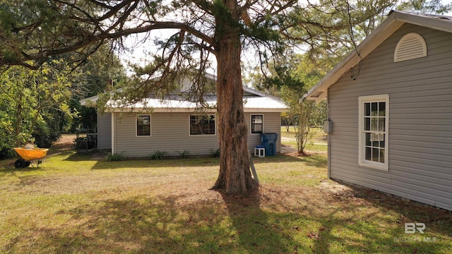 7121 N Century Blvd, Century, FL 32535 - rear view of house with a lawn