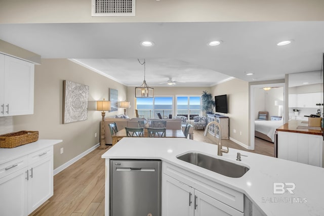 26200 Perdido Beach Blvd Unit 1403, Orange Beach, AL 36561 - kitchen with dishwasher, open floor plan, ceiling fan, crown molding, and light countertops