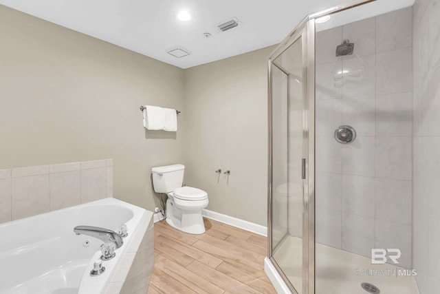 26200 Perdido Beach Blvd Unit 1403, Orange Beach, AL 36561 - bathroom featuring a bath, a shower stall, and wood finished floors