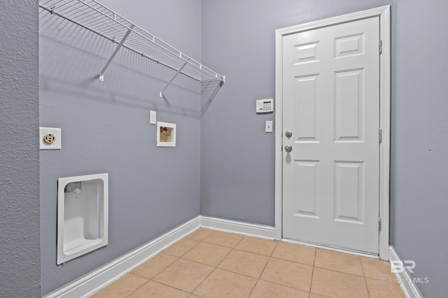 laundry area featuring light tile patterned floors, hookup for an electric dryer, and hookup for a washing machine