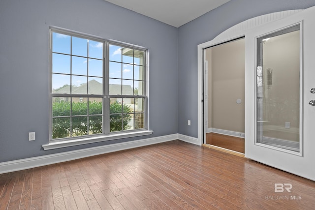 empty room featuring wood-type flooring