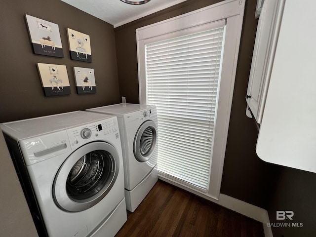 laundry area featuring dark wood-type flooring and washer and clothes dryer