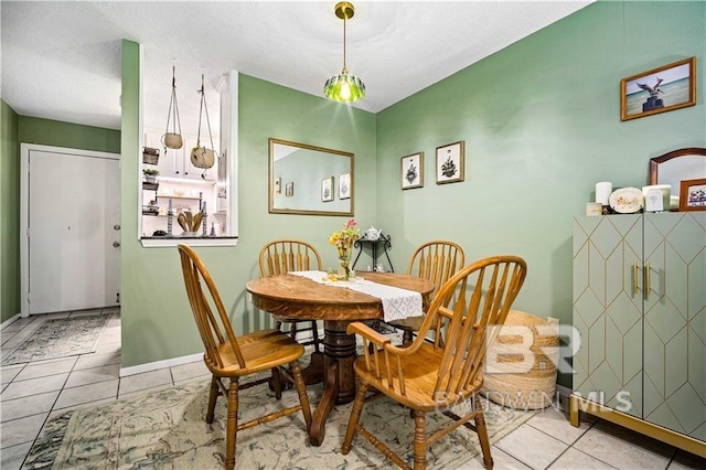 dining area featuring light tile patterned floors