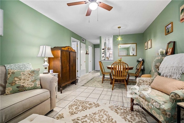 tiled living room with ceiling fan