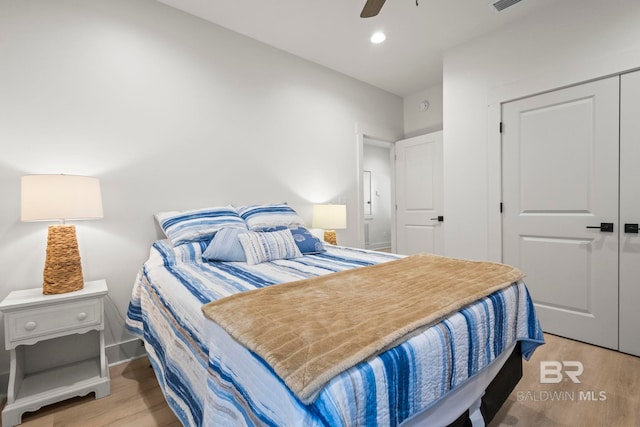 bedroom featuring recessed lighting, a closet, ceiling fan, wood finished floors, and baseboards