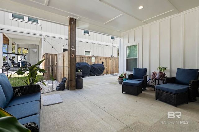 view of patio / terrace with an outdoor hangout area, area for grilling, and fence