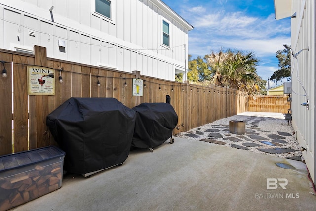 view of patio / terrace with a fenced backyard and area for grilling