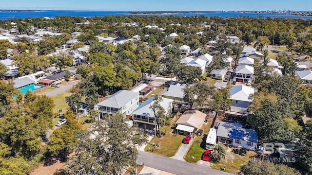 aerial view with a residential view and a water view