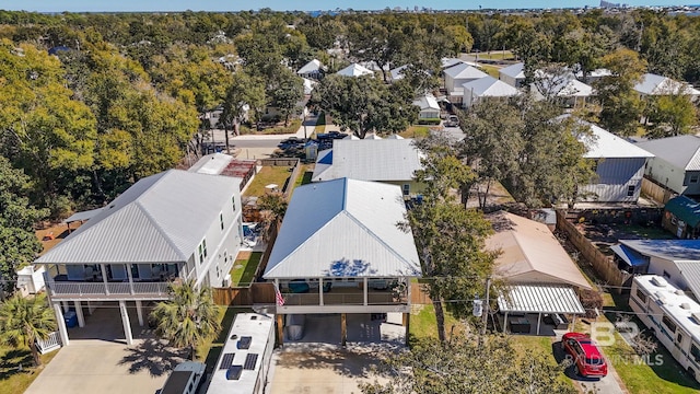 birds eye view of property with a residential view