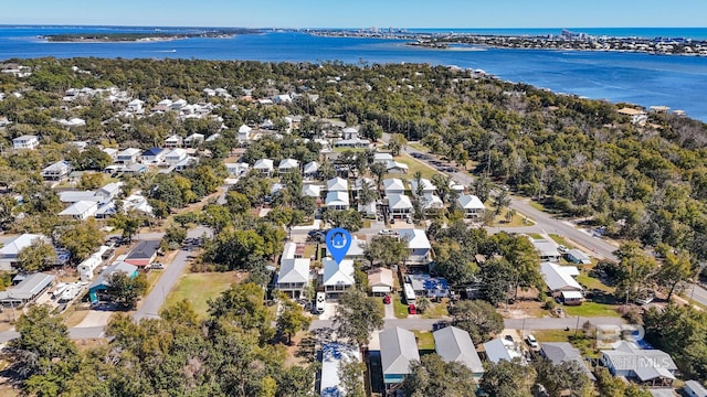 birds eye view of property featuring a water view and a residential view