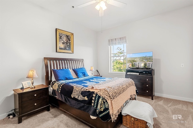 bedroom with baseboards, light carpet, and ceiling fan