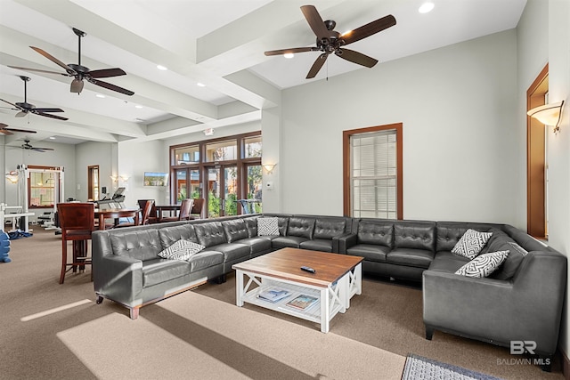 carpeted living room featuring beamed ceiling and recessed lighting