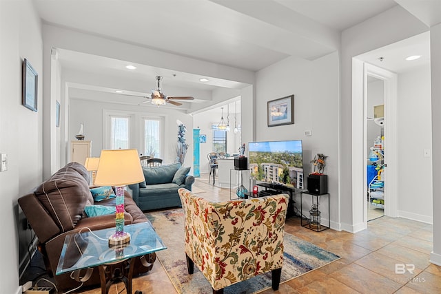 living room featuring recessed lighting, baseboards, and ceiling fan