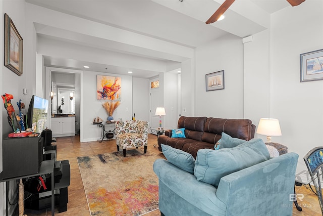 living room with tile patterned flooring, recessed lighting, and baseboards