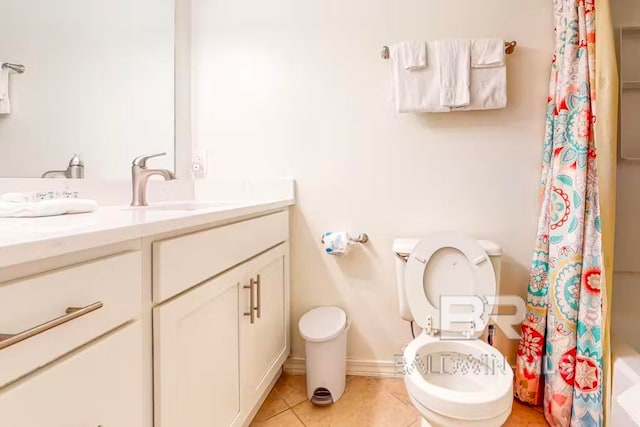 full bathroom featuring shower / tub combo with curtain, vanity, toilet, and tile patterned floors