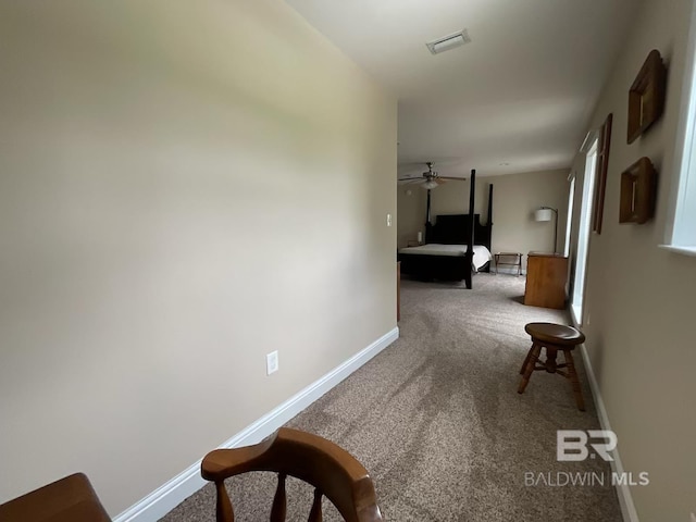 hallway with carpet flooring