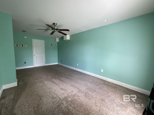 carpeted empty room with ceiling fan