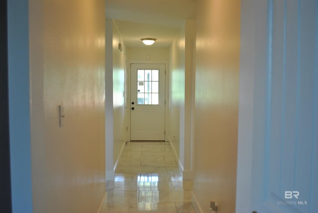 hallway with light tile patterned floors