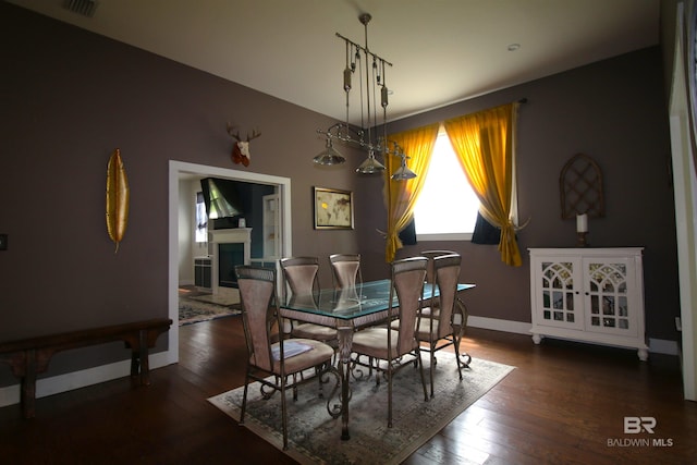 dining area featuring wood-type flooring