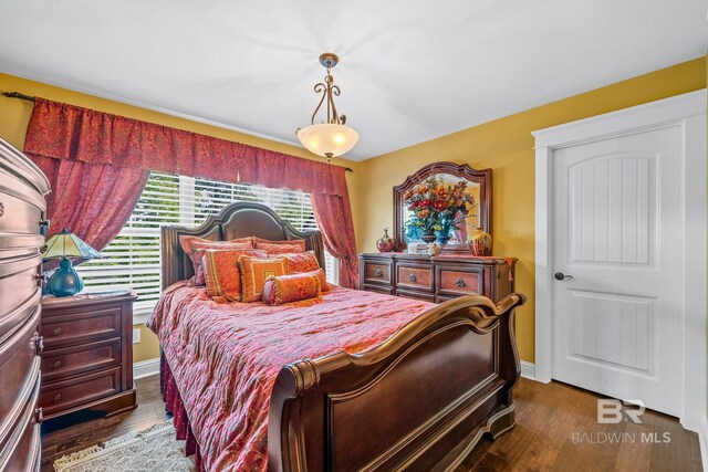 bedroom featuring dark hardwood / wood-style floors