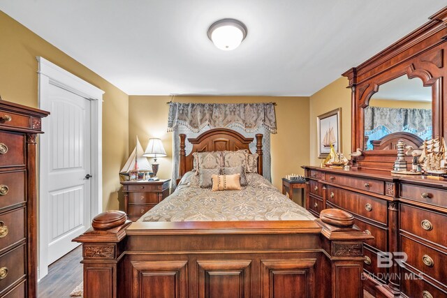 bedroom with wood-type flooring