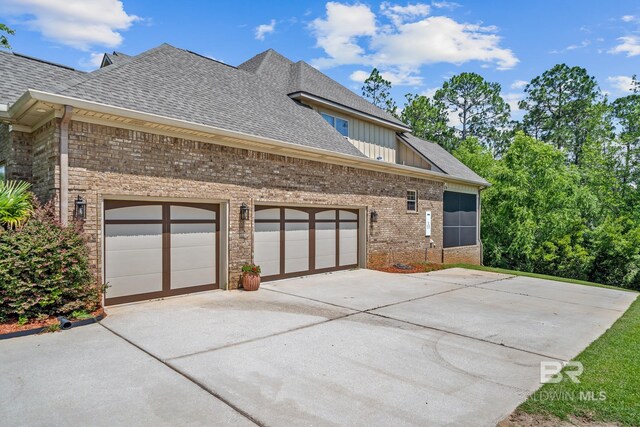 view of side of home with a garage