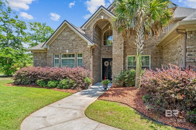 view of front of property with a front lawn